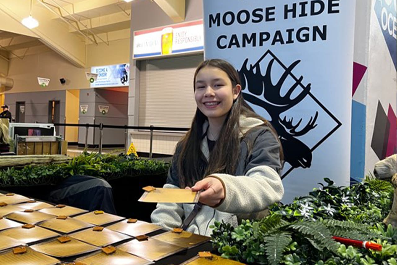 Woman handing out pins